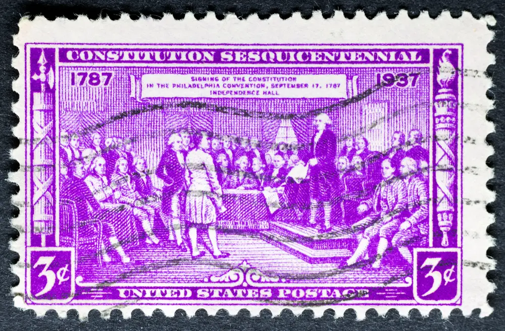 Vintage stamp showcasing signing of the Constitution of the United States of America in Philadelphia, PA