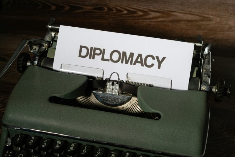 Vintage typewriter displaying the word "Diplomacy," representing field terminology, communication, definitions, leadership concepts, and operational vocabulary.